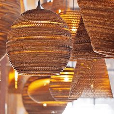 several woven baskets hanging from the ceiling