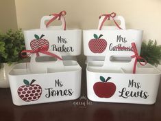 four white containers with red apples and mr and mrs signs on the front one has a ribbon tied around the top