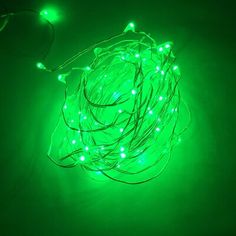 a green string of lights sitting on top of a table