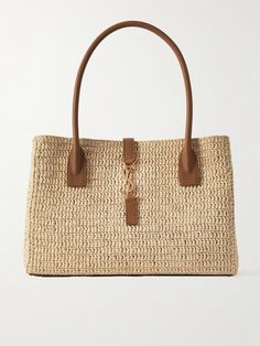 SAINT LAURENT's raffia 'Panier' tote is reinforced with a leather base and shoulder straps. It fastens with a gold-tone hook shaped like the house's initials, while the inside has a zipped pocket for storing smaller keepsakes. It's perfectly sized for seaside essentials, like your summer read, a water bottle and a tube of SPF. Spring Bags Handbags, Ysl Tote Bag, Spring Bags, Raffia Bag, Jute Bags, Saint Laurent Bag, Neutral Beige, Shopping Tote Bag, Black Tote Bag