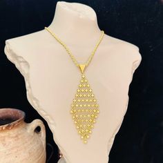 22K Gold-Plated openwork lace necklace, 925 Silver braided golden chain with pendant, turkish jewelry from Mardin. * Material: 925 Sterling Silver (22k Gold-plated). * Weight: 25 grams (chain - 13 gr, pendant - 12 gr). * Chain dimensions: 60 cm length, 3 mm thickness). IMPORTANT: * Our products are 100% handmade and can personalized. * Because this is a handicraft our shipping time takes 10 working days. * The product is sent with a gift box. * Free shipping worldwide * Delivery time: Depends on Gold Luxury Diamond-shaped Necklace, Luxury Gold Diamond-shaped Necklace, Chain With Pendant, Etsy Jewellery, Selling Handmade Items, Lace Necklace, Handmade Boutique, Golden Chain, Turkish Jewelry