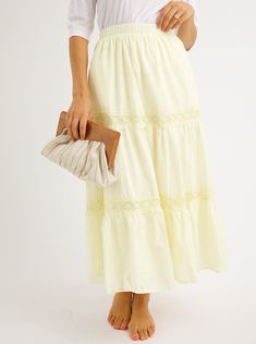 A refined take on a bohemian classic. A charming tiered skirt with pale yellow lace and elastic waist create a feminine feel for summer. Fit: Runs True To Size Fabric Content: 100% CottonFabric Care: Machine Wash Cold Gentle Cycle, lay flat to dryMeasurements: 34" LongLining: Yes, 100% PolyesterZipper: No S:0-2 M:4-6 L:8-10 Chic Spring Maxi Skirt With Lace Trim, Chic Lace Trim Maxi Skirt For Summer, Casual Spring Maxi Skirt With Lace Trim, Cream Tiered Skirt With Lace Trim, Feminine Tiered Maxi Skirt For Summer, Summer Lace Tiered Maxi Skirt, Summer Lace Tiered Bottoms, Tiered Lace Bottoms For Summer, Tiered Lace Summer Bottoms