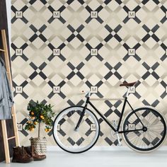 a black and white wall with a bike next to it