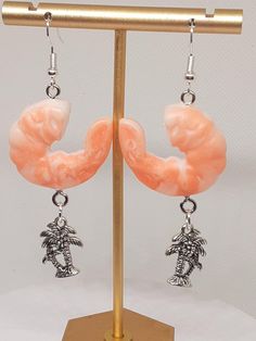 These unique earrings are  made with  resin charms and silver tone materials.  Be sure to check out my matching bracelet too. Ocean Tropical, Tropical Gifts, Hoop Dangle Earrings, Earrings Summer, Matching Bracelet, Resin Charms, Matching Bracelets, Best Vacations, Unique Earrings