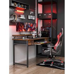 a computer desk with a chair in front of it and red lights on the wall