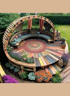 a circular wooden bench sitting in the middle of a lush green field with lots of flowers