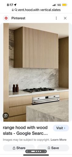 an image of a kitchen with wood cabinets and white marble counter tops on instagram