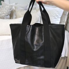 Are you in need of an everyday bag that will hold all of your belongings!? The Mini Weekender Tote is your answer! Whether you are packing for a quick trip or lugging things around town, this bag is great for your daily use. The zipper at the top + the pouch on the inside create the perfect look. 14" tall x 22" wide x 8" deep Black Large Capacity Satchel For Weekend Trips, Large Capacity Backpack Weekender Bag, Large Capacity Weekender Backpack Bag, Everyday Practical Duffle Bag With Removable Pouch, Everyday Travel Backpack With Leather Handles, Large Capacity Weekender Backpack, Versatile Shoulder Bag With Zipper For Weekend Trips, Practical Duffle Bag With Removable Pouch For Everyday, Large Capacity Everyday Travel Backpack