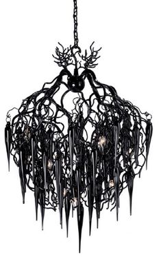 a black chandelier hanging from a chain with branches and lights on top of it