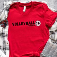 This personalized senior volleyball shirt is perfect for a volleyball mom! It is a Bella+Canvas Unisex tee that fits like a well-loved favorite. These t-shirts are made with soft, 100% cotton and have ribbed knit collars. Perfect for active and leisure wear. As shown in the photos, the volleyball design will be printed in black ink on the White and Athletic Heather shirt colors. The design will be printed in white ink on all the other shirt color options. SHIRT INFORMATION & SIZING: The Bella+Ca Volleyball Mom Shirts, Volleyball Designs, Volleyball Shirt, Volleyball Mom, Senior Gifts, Grandma Shirts, Bella Canvas Tees, Favorite Shirts, Volleyball