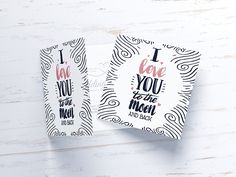 two tags with the words i love you to the moon and back printed on them