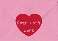 an open envelope with a red heart and the words'open with care'written on it