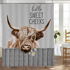 a shower curtain with a cow's head and the words hello sweet cheeks on it