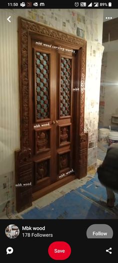 an old wooden door in the middle of a room