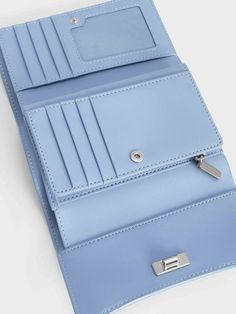 Add a sophisticated touch to your everyday looks with this light blue iteration of our Huxley front flap wallet. Featuring a sleek curved front flap and knotted silver-toned metallic accent, this charming piece will elevate your style game in an instant. Opening up to reveal multiple compartments that will keep your cards, cash and other small items neat and organised, this sweet accessory is the epitome of functional style. Sweet Accessories, Functional Style, Charles Keith, Metallic Accents, Card Wallet, Everyday Look, Patch Pocket, Silver Tone, Initials