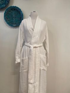 its a unisex Turkish cotton robe This muslin cotton robe is perfect gift for your loved ones. Simple and beautiful in natural midnight blue and white color. SPECIFICATION * Fabric: 100% Cotton S, M, L sizes available. CARE INSTRUCTION * Machine Wash Warm and Seperately * Do Not Tumble Dry * Iron inside out and Warm * Do Not Bleach * Dryclean, Do Not Tumble You may order luxurious gift boxes together with your purchases for your loved ones. The link for a beautiful gift box is below; https://www. Long White Robe For Home, Open Front Cotton Robe For Loungewear, Cotton Open Front Robe For Loungewear, White Long Kimono For Loungewear, White Wrap Robe For Daywear, Oversized Cotton Robe For Relaxation, Cotton Wrap Robe For Home, White Cotton Relaxed Fit Robe, White Long Sleeve Relaxation Robe