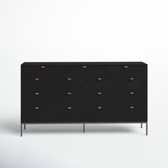 a black dresser with wooden drawers and metal legs