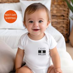 Welcome to Our Store! We offer Bella+Canvas soft t-shirts, long sleeves, women's shirts, and women's V-neck shirts, Gildan sweatshirts & hoodies, Next Level tank tops for men and women, and 100% cotton baby bodysuits from Gerber, Rabbit Skins, and LAT--all eco-friendly. Get the size, color, and design that suits you best! Note: Next Level tank tops run small; we recommend ordering one or two sizes up. All Solid Colors are 100% Cotton. All Heather Colors are a cotton and poly mix. Our t-shirts, l Customizable Fitted Onesie For Family Matching, Family Matching Short Sleeve Onesie With Name Print, Casual Personalized White Onesie, White Personalized Short Sleeve Onesie, Casual White Personalized Onesie, Customizable Cotton Bodysuit For Family Matching, Custom Name White Cotton Onesie, White Custom Name Fitted Onesie, White Fitted Onesie With Custom Name