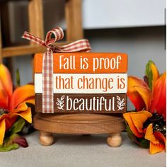 a wooden sign that says fall is proof that change is beautiful