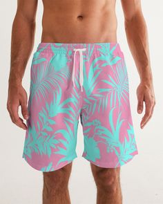 Men's Swimsuit, Tropical Foliage Pink and Teal Blue Pink and Teal Tropical Floral Leaf swim trunks. Bright turquoise blue and vibrant pink tropical foliage print Product Details Head to the beach in our classic fit Men's Swim Trunks made with comfort in mind. With an adjustable drawstring waistband, its smooth and durable materials made with UPF 50+ gives you premium UV protection. Soft, lightweight fabric Drawstring waistband UPF 50+ Built-in mesh brief Two side, one back slip pocket Printed, c Pink Swim Trunks For Beach Vacation, Tropical Style Short Swim Trunks, Pink Swim Trunks For Beach Season Vacation, Tropical Swim Trunks For Summer, Pink Tropical Style Shorts For Poolside, Pink Swim Trunks For Beach Season, Pink Beachwear Swim Trunks For Beach Season, Pink Beachwear Swim Trunks For Vacation, Pink Beachwear Shorts For Beach Party