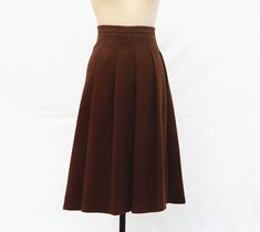 " *Length approx: 75cm *Pleated skirt *Fabric: woolen *Lining: polyester fiber *There is no pocket *Elastic fabric If you need pockets, please leave a message and we can add pockets for free. We can customize other skirt lengths, please contact us if you have any questions, we will be happy to answer Auailable in women's us size XXS to 3XL as well as custom size and plus size  XXS: Waist:66cm/26\" Length:75cm/29.5\" XS: Waist:70cm/27.5\" Length:75cm/29.5\" S: Waist:74cm/29\" Length:75cm/29.5\" M Fitted Wool Skirt In A Solid Color, Fitted Pleated Pencil Skirt For Fall, Wool Midi Pleated Skirt, Elegant Brown Lined Pleated Skirt, Fitted Brown Flared Skirt, Wool Pencil Skirt With Lining, Knee-length Brown Skirt For Fall, Brown Midi Pencil Skirt For Fall, Brown Fitted Flared Skirt