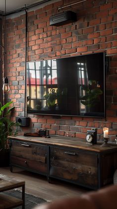 a flat screen tv mounted to the side of a brick wall in a living room