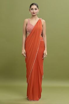 Coral orange pre-draped saree featuring bead and sequin embroidery on the hem. Paired with a bead embroidered, tassel detailed blouse. - Aza Fashions Orange Pre-draped Saree For Party, Party Wear Orange Georgette Pre-draped Saree, Orange Georgette Pre-draped Saree For Party, Orange Pre-draped Saree With Unstitched Blouse, Fitted Orange Pre-draped Saree, Orange Georgette Pre-draped Saree, Bollywood Style Orange Pre-draped Saree For Party, Orange Pre-draped Saree For Party And Festive Occasions, Festive Orange Pre-draped Saree For Party