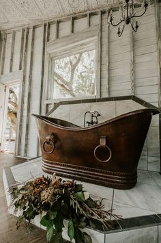 an old fashioned bathtub in the corner of a room