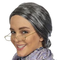 Skeleteen Old Lady Costume Set is the perfect accessories set for granny costumes. It is a favorite among kids and adults and can be worn on Halloween, Christmas or for every day dress up. The set includes a gray librarian style wig with a bun in the back that can be used to portray an old lady, Mrs. Clause, or a librarian. The glasses that are included in the set are non-prescription and small. The frames are of Victorian style and were used to portray influential people of the times. This set Granny Wig, Granny Costume, Old Lady Dress, Grandma Costume, Grey Hair Wig, Old Lady Costume, Librarian Style, Old Lady Humor, Rectangle Eyeglasses