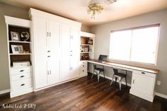 an empty room with white cabinets and wood flooring is pictured in this image, there are three chairs at the desk