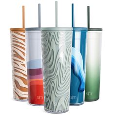 four different colored tumblers with straws in each one and the same logo on them