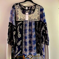 Lightweight, Sheer, Navy Blue With White Crochet Overlay On Front Of Blouse. Long Sleeve With Navy Lace About 1” Past Armpit.Stretch Elastic At End Of Sleeve. 100%Rayon, Made In India. Hand Wash In Cold Water. Color Is Medium Blue, Navy Blue And White On Front Chest. Blue Floral Print Tunic Top, Blue Tunic Top For Vacation, Blue Tunic Blouse For Vacation, Blue Bohemian Tunic Top, Blue Tunic Blouse For The Beach, Floral Peasant Top, Floral Peasant Blouse, Crochet Overlay, White Floral Blouse