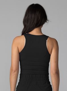 The BDlab Sportswear Every Day Tank is a four-way stretch, form fitting tank that can be worn as a top layer over a sports bra for workouts or on it's own to elevate your every day style. Constructed with a Sustainable Ribbed Tencel™ Modal fabric meticulously sewn in NYC. Style it over our Cross Back Sports Bra for workouts or pair with our Cargo Pant, Flared Trouser, Adventure Short or Midi Skirt for a polished, elevated look. Four-way stretch Sustainable Ribbed Tencel™ Model with Spandex 90% T Black Tank Top With Built-in Bra For Pilates, Black Seamless Tank Activewear, Black Compressive Tank Top For Yoga, Black Tank Top With Built-in Bra For Workout, Black Sporty Seamless Tank Top, Black Workout Tank Top With Built-in Bra, Black Compressive Racerback Top, Compressive Black Sportswear Tank Top, Black Compressive Tank Top For Pilates