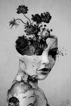 a woman's head with flowers in it and the image is black and white