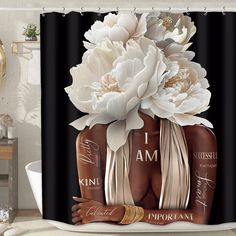 a shower curtain with two bottles and flowers on it