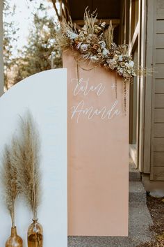 a couple of vases sitting next to a sign