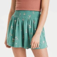 American Eagle Green Floral Smocked High Waisted Everyday Soft Shorts Size Xs Shorts Made To Move With You. Roam With Ease. Made From A Lightweight Fabric For An Easy Touch Smocked Waist Printed Pockets Pull-On Short Free & Flowy Style: 1317-3528 | Color: 300 12½" Waist 13" Rise 20" Hips 3" Inseam Materials & Care 100% Viscose Machine Wash Spring Bottoms With Gathered Waist For Daywear, Gathered Waist Bottoms For Summer, Casual Bottoms With Smocked Back For Daywear, Summer Ruched Bottoms For Day Out, Summer Bottoms With Smocked Back For Daywear, Casual Beach Bottoms With Smocked Bodice, Casual Shorts With Smocked Back For Day Out, Summer Smocked Top With Stretch And Elastic Waistband, Elastic Waistband Shorts For Spring