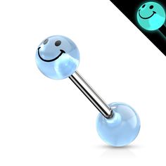 a smiley face ball and barbell ring with glow in the dark colors on it