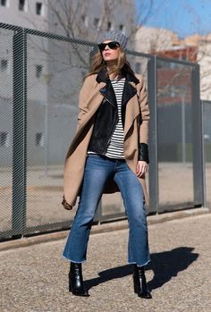 With gray hat, sunglasses, black leather jacket, beige knee length coat, leopard printed bag and black leather boots Crop Flare Jeans With Boots, Dark Wash Cropped Flare Jeans, Flare Crop Jeans Outfit, Cropped Flare Jeans Outfit, Flare Jeans Outfit Winter, Flared Jeans Outfit Fall