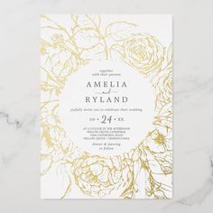 a wedding card with gold foil flowers on it