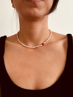 - - - DETAILS - - - Pearl Size: 3-4 mm 100% Natural Fresh Water Pearls Chain Length:  36+5cm extender chain Material: 18 K Gold Plated It is designed with the perfect combination of 3mm real freshwater pearls and red bar coral. *It is designed using undrawn natural pearls. *Pearls are a gem of introspection that encourages us to truly discover our true selves and our true purpose in the world. *Since coral stone comes to life from a skeleton, it symbolizes immortality, wisdom and happiness. It i Elegant Strand Beaded Necklaces As A Gift, Beaded Strand Jewelry Gift, Pearl Necklaces With Spacer Beads For Beach, Beaded Chain Strand Beads Gift, Pearl Strand Beaded Necklace Gift, White Beaded Heart-shaped Pearl Necklace, Beaded Strand Jewelry As A Gift, Pearl Beaded Strand Necklace For Gift, Colorful Bead Strand Necklace For Gift