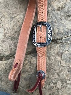 "Hand made 1.5\" wide headstall with buckle. These headstalls are made in our shop and are made to order. Buckles may vary as inventory changes and new styles are released. They are made from Heavy 14/16 ounce Herman Oak leather. Embossed with the Western Floral, Basketweave, Plain, and soon barbwire. Jermiah Watt Hardware is used and is top quality stainless steel hardware. These headstall get compliments wherever you go and a great using piece of tack." Adjustable Brown Traditional Belt Buckles, Traditional Adjustable Brown Belt Buckles, Adjustable Western Concho Belt Buckles, Adjustable Brown Belt Buckles For Rodeo, Rustic Hand Tooled Adjustable Belt Buckles, Adjustable Concho Belt Buckles For Western-themed Events, Handmade Adjustable Western Belt Buckles, Western Brown Adjustable Belt Buckles, Western Adjustable Belt Buckles For Rodeo