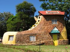 a building made out of rocks with a sign that says save on the front and side