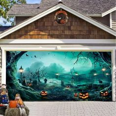 a garage door decorated with pumpkins and jack - o'- lanternes for halloween