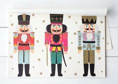 three nutcrackers are standing next to each other