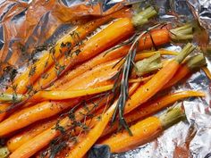 roasted carrots with herbs on aluminum foil