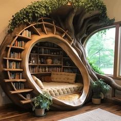 a living room with a tree shaped book shelf and couch in it's center