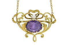 "With sinuous, scrolling, flowing vines, this authentic antique Art Nouveau amethyst necklace is a dynamic and naturalistic accessory. A masterpiece circa 1910, hand fabricated of buttery 14k yellow gold with raised fretwork vines terminating with a delightful intertwined motif and crowned with a lustrous natural pearl. The velvety, deep lavender-violet amethyst surrounded by numerous eagle claw prongs. Condition: Very Good Era: Art Nouveau Year: 1910 Metal: 14K, 10K Chain Center Amethyst: Carat Estate Engagement Ring, Authentic Art, Eagle Claw, Filigree Necklaces, Heart Necklace Diamond, Antique Brooches, Art Nouveau Jewelry, Violet Purple, Natural Pearl