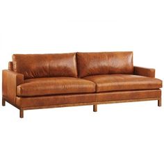 a brown leather couch sitting on top of a wooden frame