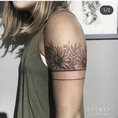 a woman with a sunflower tattoo on her arm